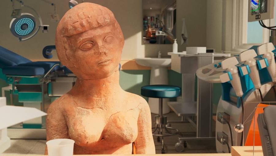 A digitally animated terracotta fertility figurine with a rounded body and one cupped hand, seated at a counter in a rendered fertility clinic with a gynecological chair, sink and medical equipment behind it, a still from Ruth Patir's video installation (M)otherland