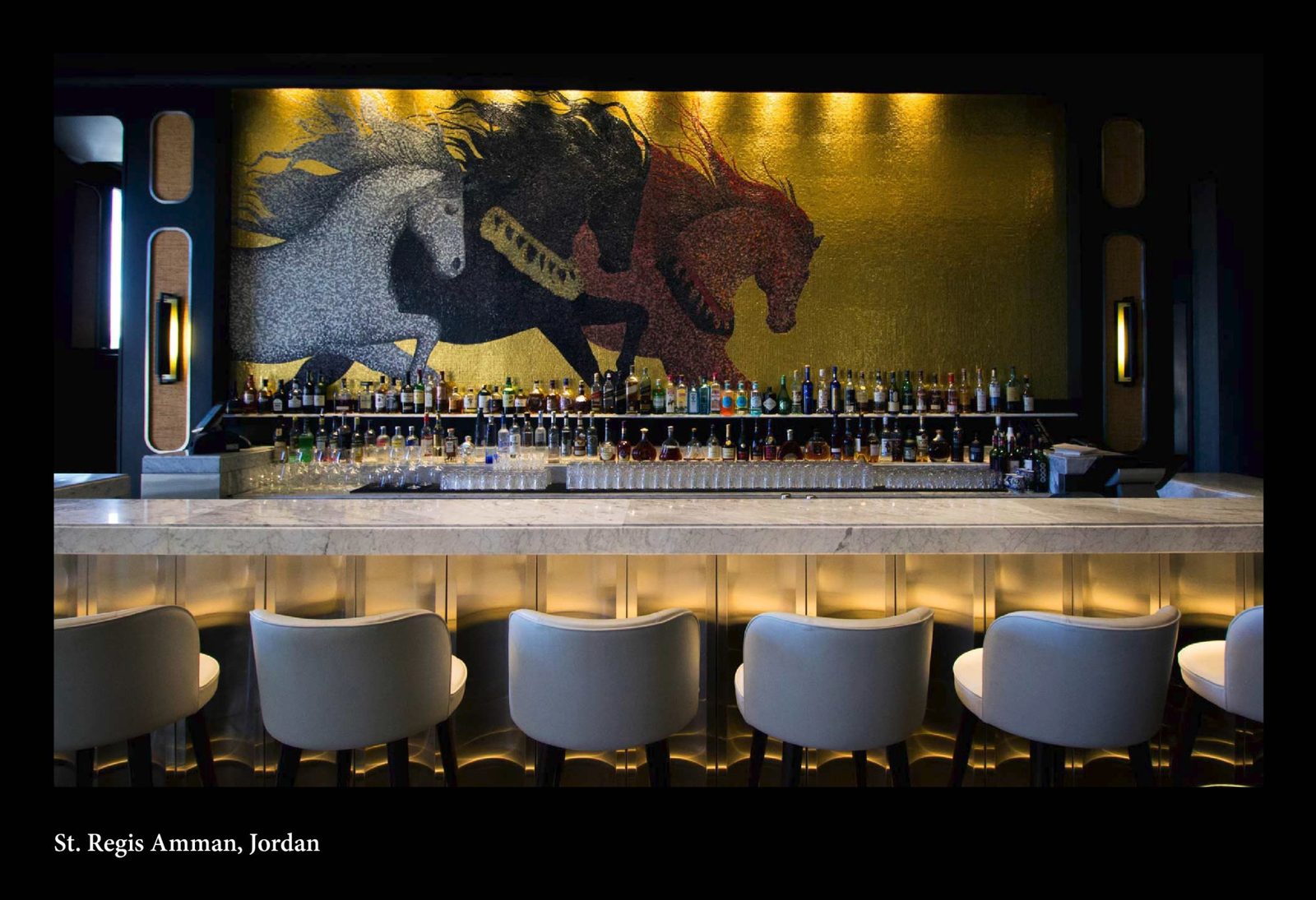 Bar at the St. Regis Amman with a large horse mosaic on the wall