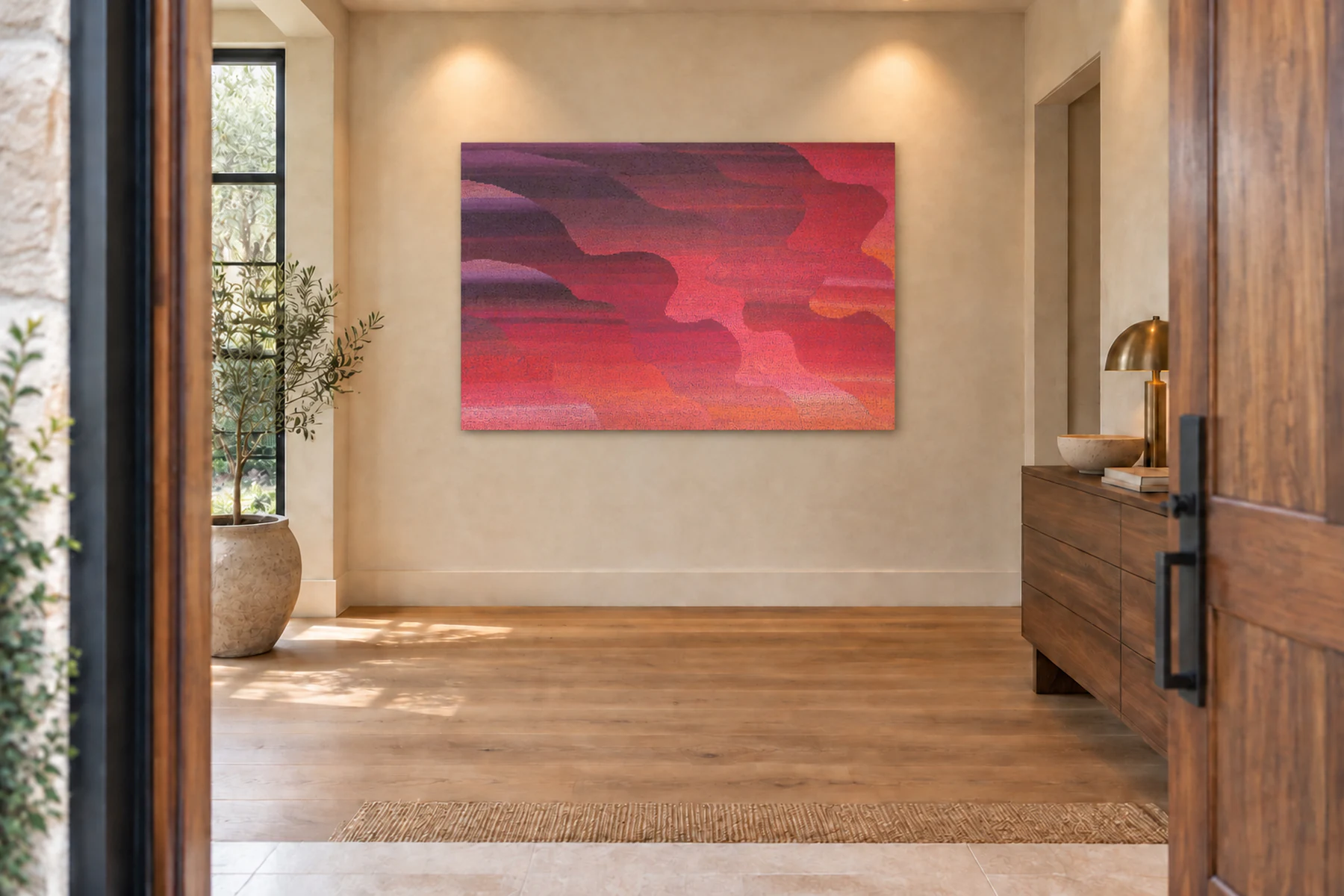 The same entry hall with one large unframed abstract of rippling crimson, magenta and coral bands on the wall facing the door.