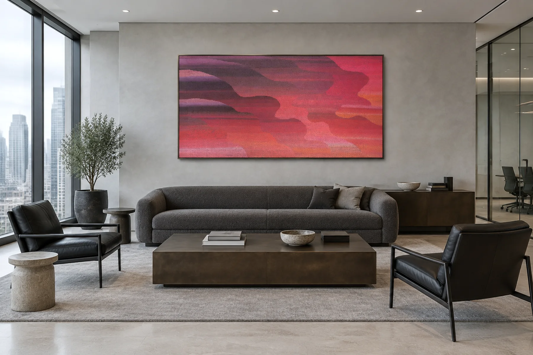 A lounge high over Manhattan: a wide abstract in crimson, magenta and coral above a charcoal sofa and black leather chairs.