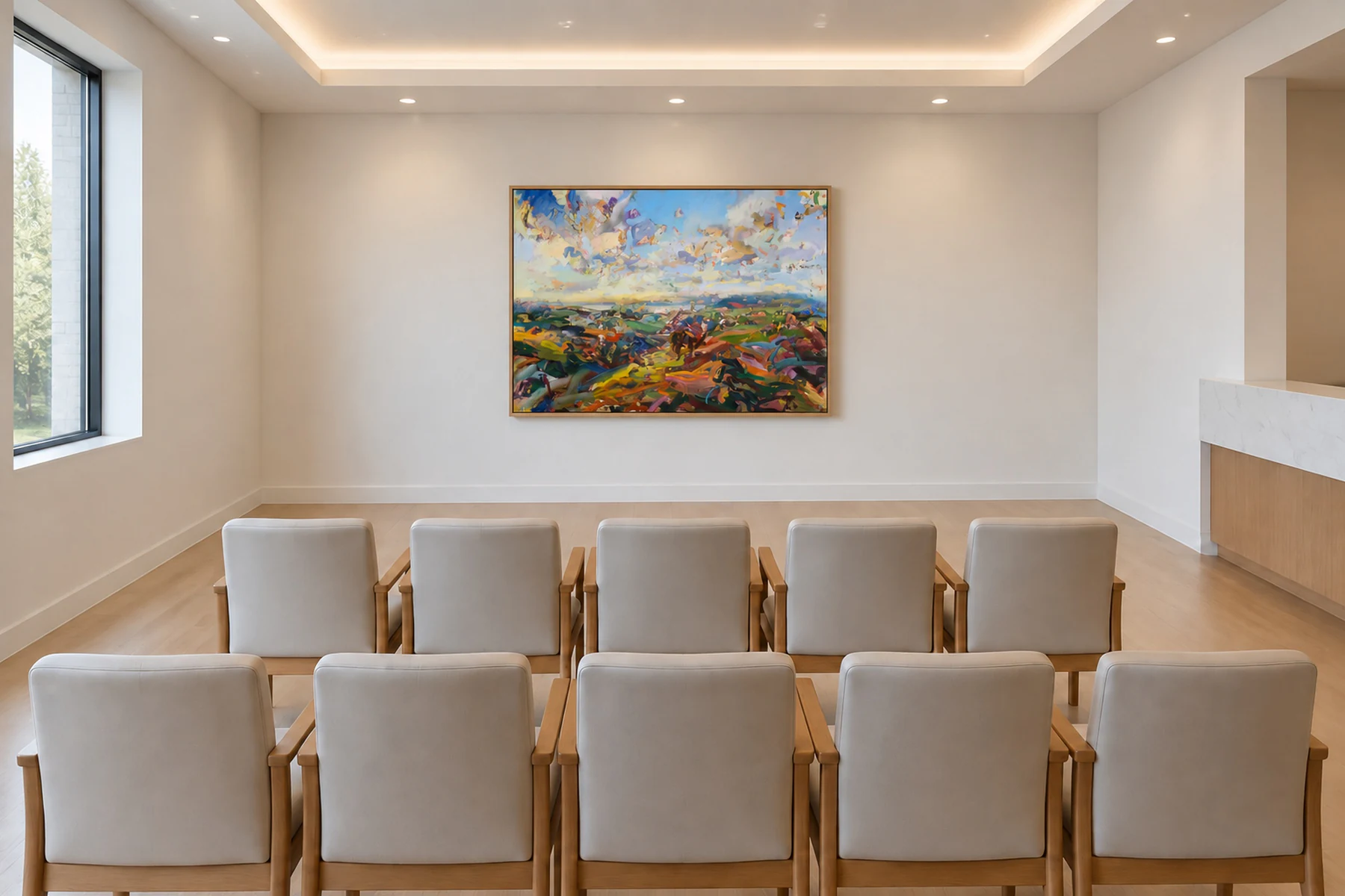 The same waiting room with one wide landscape of bright hills under a sky full of clouds, centered on the wall the chairs face.
